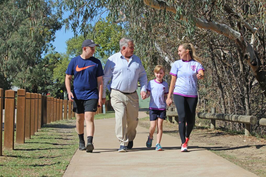 ON THE PATH: Sunshine Walk ambassador Hayden Sampson, 16, chats with cancer centre trust board's John Watson and fellow ambassadors Lucy, 9, and Cristy Jacka.