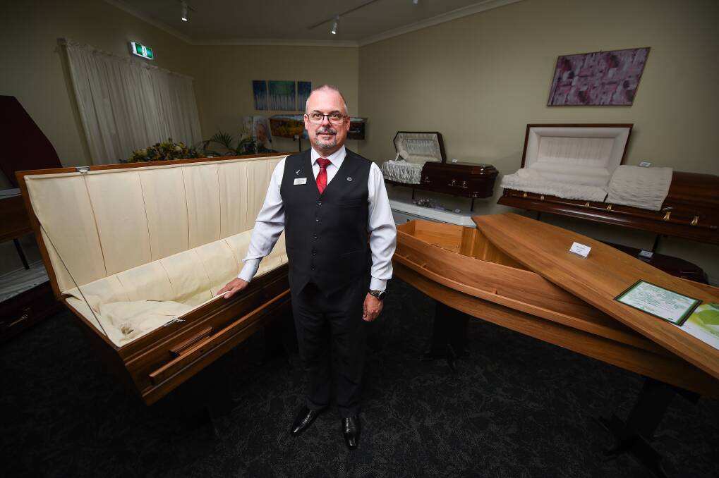 OPEN SUBJECT: Manager Brett Williams stands in the John Hossack Funeral Services coffin showroom, a place where difficult decisions need to be made. Picture: MARK JESSER