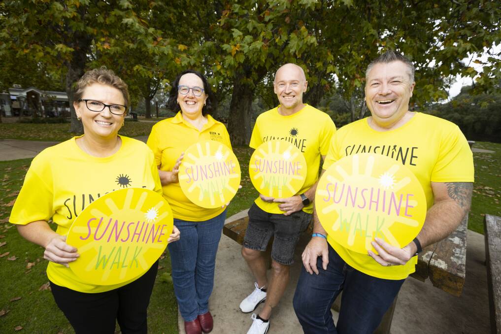 WALKING ON SUNSHINE: Ambassador Sunnie Bull joins Albury Wodonga Regional Cancer Centre Trust Fund board member Di Thomas and fellow ambassadors Richard Bull and Mark Haley at Friday's event launch. Picture: ASH SMITH