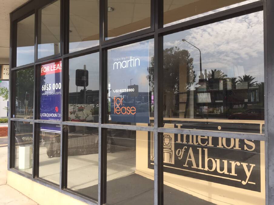 SIGN OF THE TIMES: For Lease signs sit in the window of Interiors of Albury.