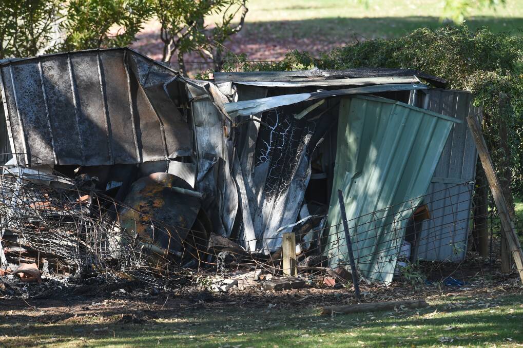 TRAGIC AFTERMATH: Two men died when their car collided with an earthen road barrier in Corowa, became airborne and crashed into a garden shed in April 2018.
