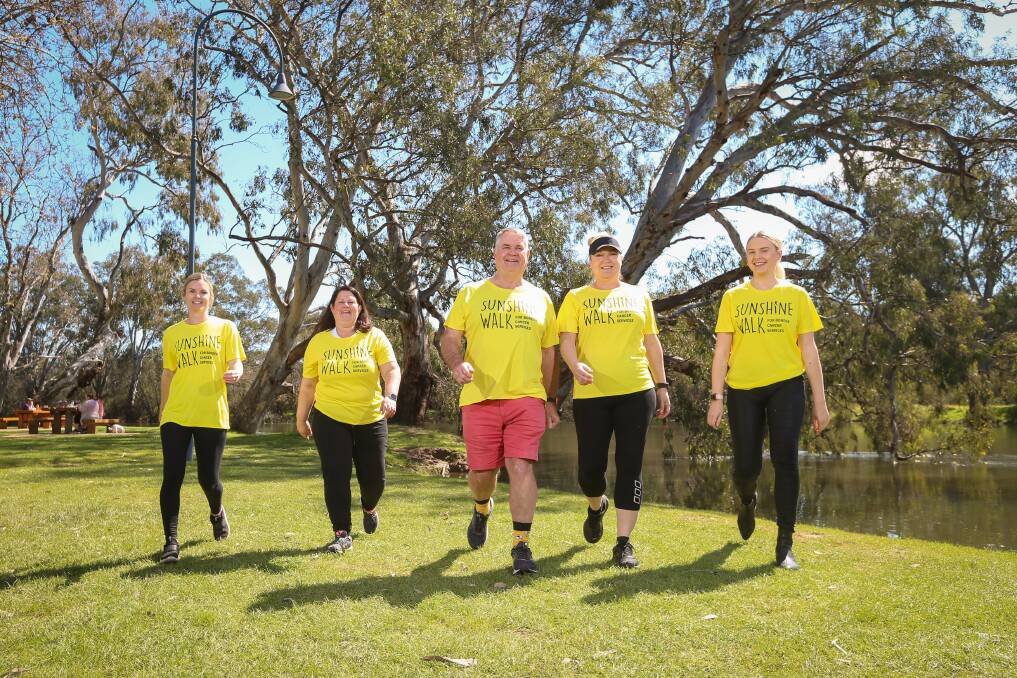 IN THEIR STRIDE: Trust fund board member John Watson joins Team Bliss members Kylie Miller, Renea Maskell, Kellie McDonald and Lily Pickles as they walk together. Picture: JAMES WILTSHIRE