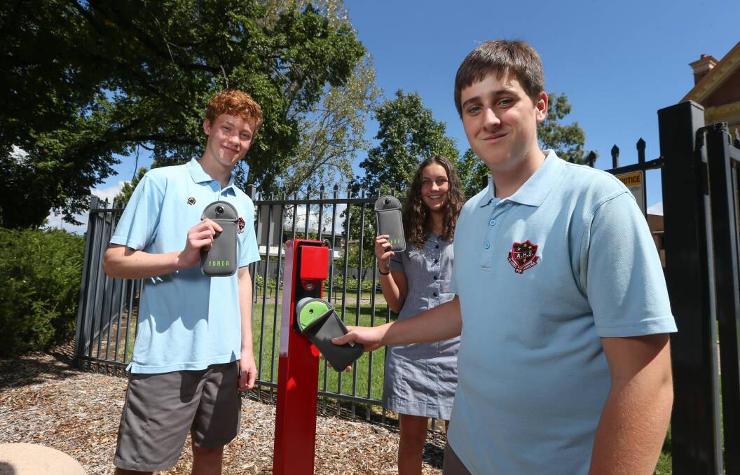 SMOOTH SYSTEM: Year 12 students Campbell McTernan, Meghan Yensch and Luke Lee at a gate station. Picture: TARA TREWHELLA