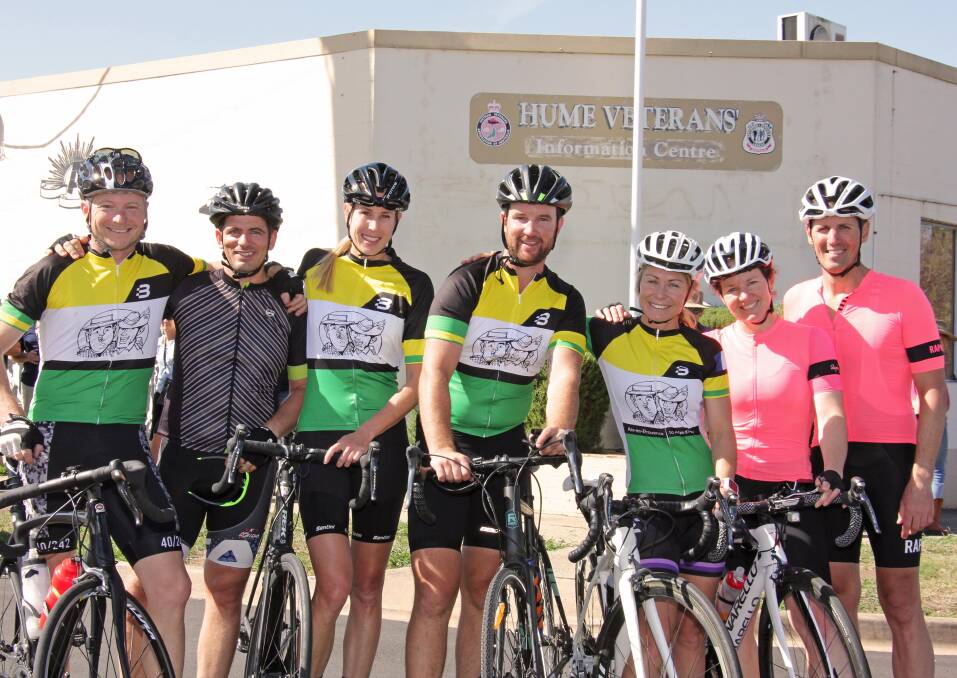 FINISH LINE: Matt Aldridge (centre) with a group of serving and former army personnel as The Coo-Wee Ride completes its last leg in Wodonga. Picture: SALLY HARDING 