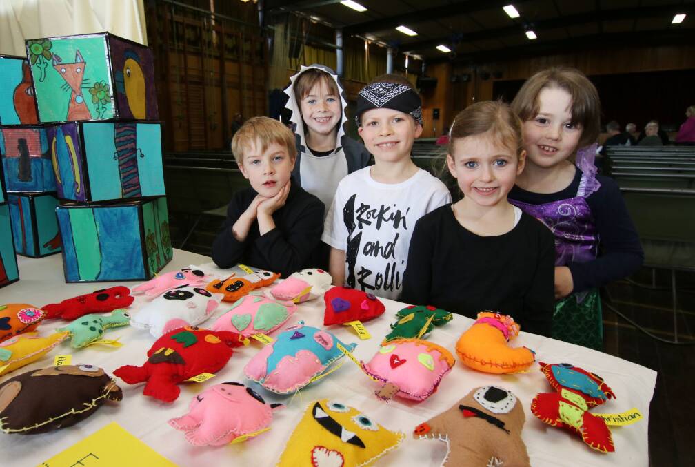 COLOURFUL CREATIONS: Kiewa Valley Primary School's Zac Parsons, Jack Knight, Alex Mathews, Ruby Mathews and Mackenzie Rasmussen look over the visual art displays at last year's festival.