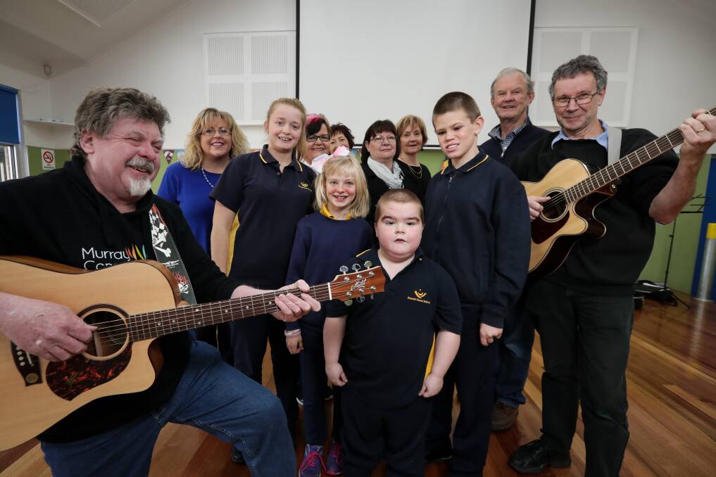 RAISING VOICES: Wewak Street School students Hannah Clarke, 18, Mackelle Lake, 11, Cody Segelow, 10, and Jordin Free, 12, sing along with members of Rotary Club of Albury North, Murray Conservatorium and other singers looking forward to Border Choral Voice. Picture: JAMES WILTSHIRE