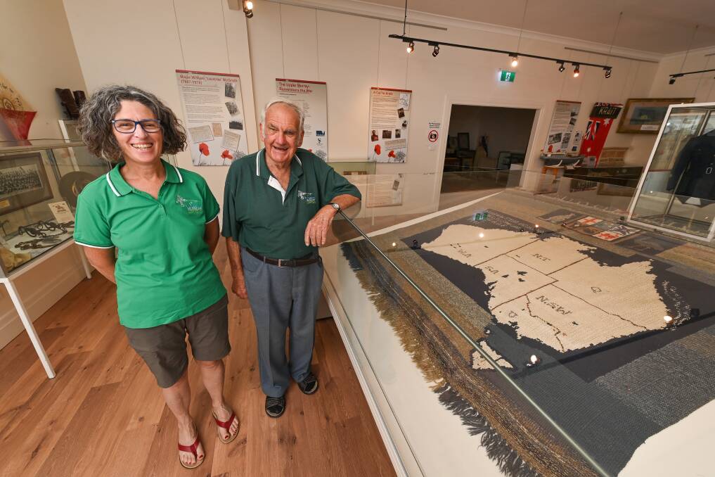 PROUD HISTORY: Upper Murray Historical Society project officer Marita Albert and president John Whitehead at The Man From Snowy River Museum in Corryong, which is run by the society. Picture: MARK JESSER