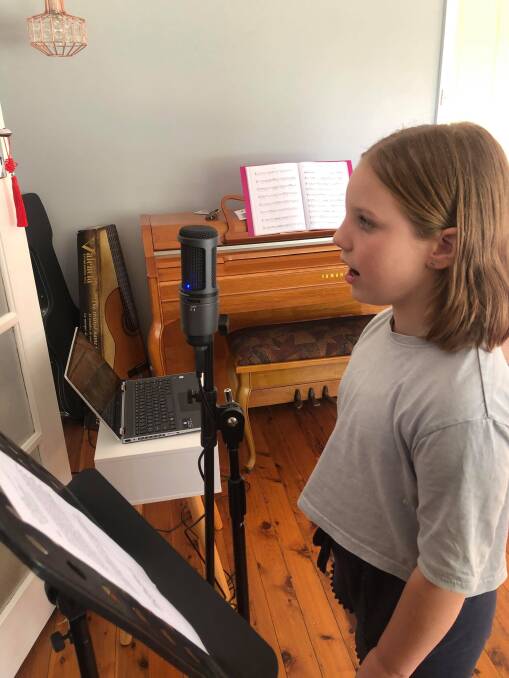 HOME STUDIO: Nine-year-old Mabelle Strauss, of Albury, records segments for an episode of Kids Pod, a Border project that offers children a new creative outlet.