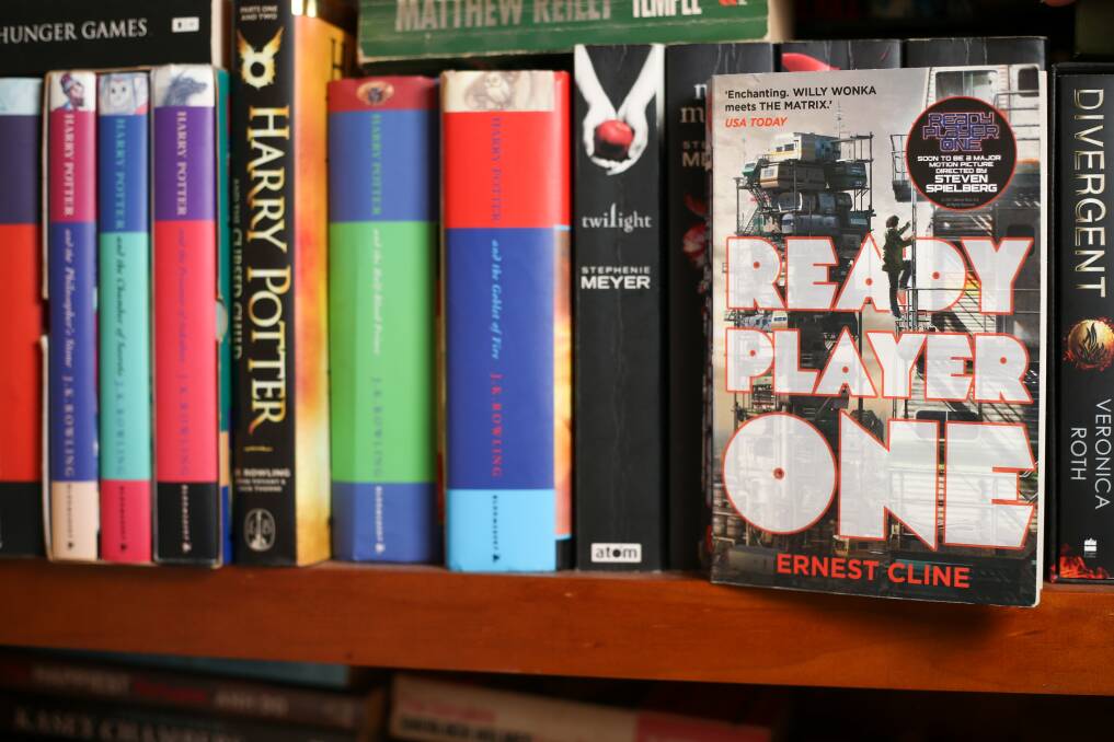 COMMON THEMES: Ready Player One by Ernest Cline sits in Melissa Kane's collection of young adult novels. Picture: JAMES WILTSHIRE