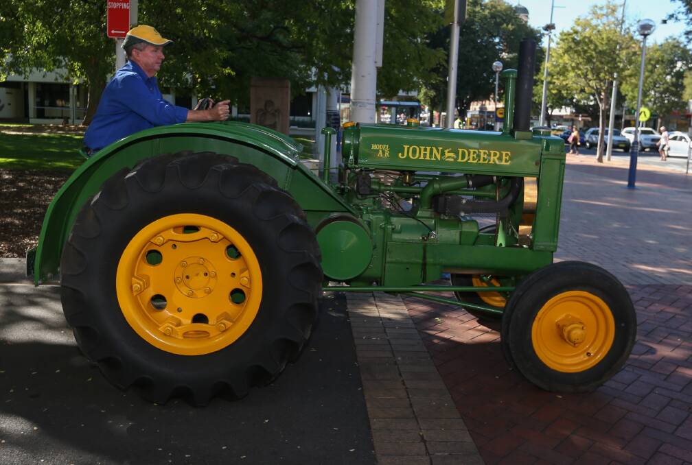WHEEL THEM OUT: Tractors aren't often seen in Albury's Dean Street, but Wally Shannon took a turn in the central business district on Thursday ahead of this weekend's 49th Steam and Vintage Rally. Picture: TARA TREWHELLA