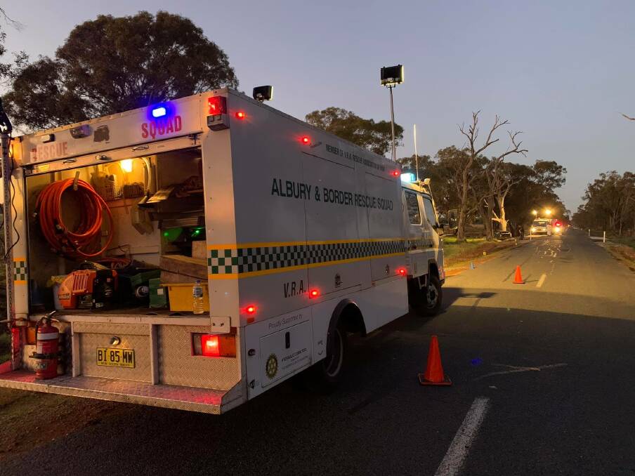 ASSISTANCE: Albury and Border Rescue Squad members help police with lighting at the scene of the car crash. Picture: FACEBOOK