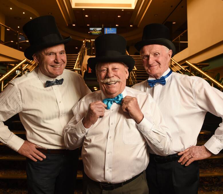IN THE MOOD: Albury-Wodonga Prostate Cancer Support Group members Glenn Rose, Errol Smith and Don Bensley suit up for the ball, to run from 6.30pm until midnight on September 17, with dancing from 8pm. Picture: MARK JESSER