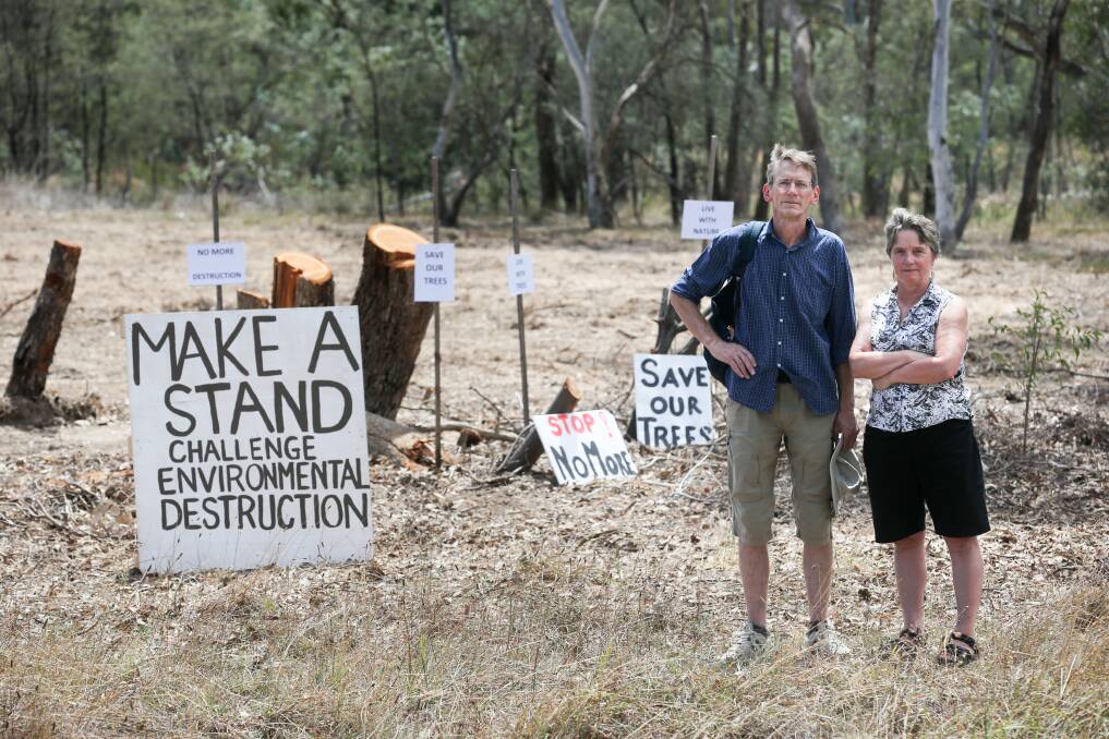 SAVE OUR TREES: Thurgoona Community Action's Chester Merrick and Sally Hendy make their group's message clear. Picture: KYLIE ESLER