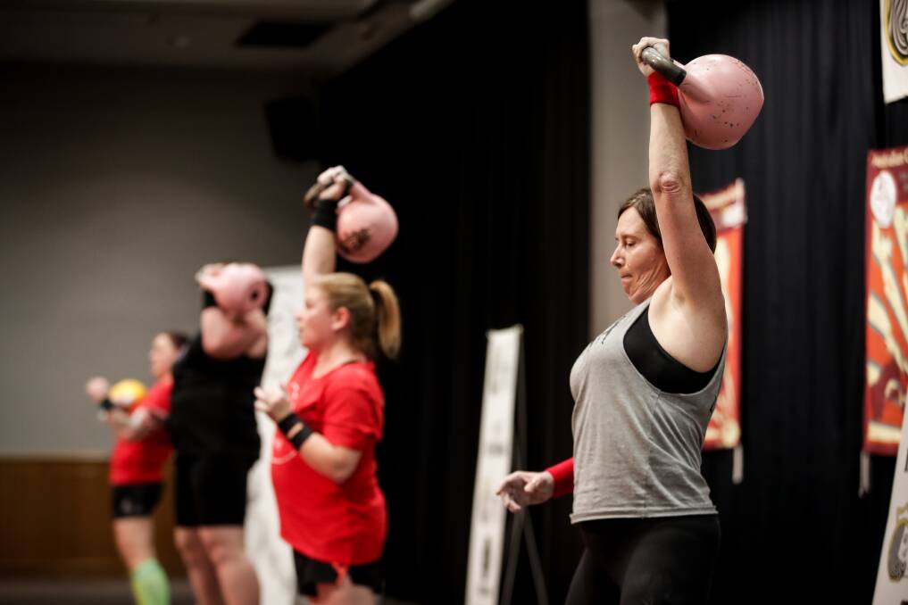 FOCUS ON FORM: Joanne Parker, of Gerogery, competes in the women's one-arm jerk section of the Australian National Kettlebell Championships, hosted by Border personal training company Lonedog. Picture: JAMES WILTSHIRE