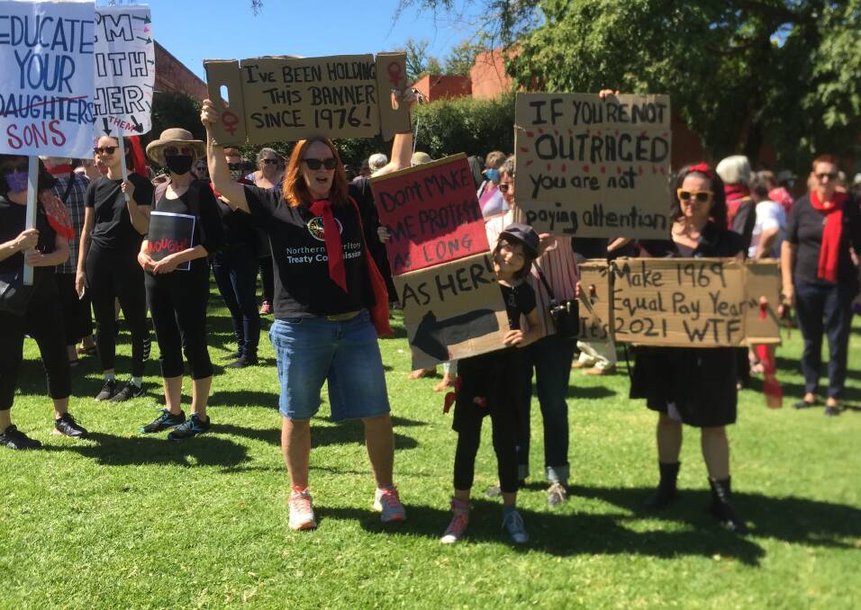 ACTION NEEDED: Signs made feelings clear at the Albury March 4 Justice event at QEII Square on Monday.
