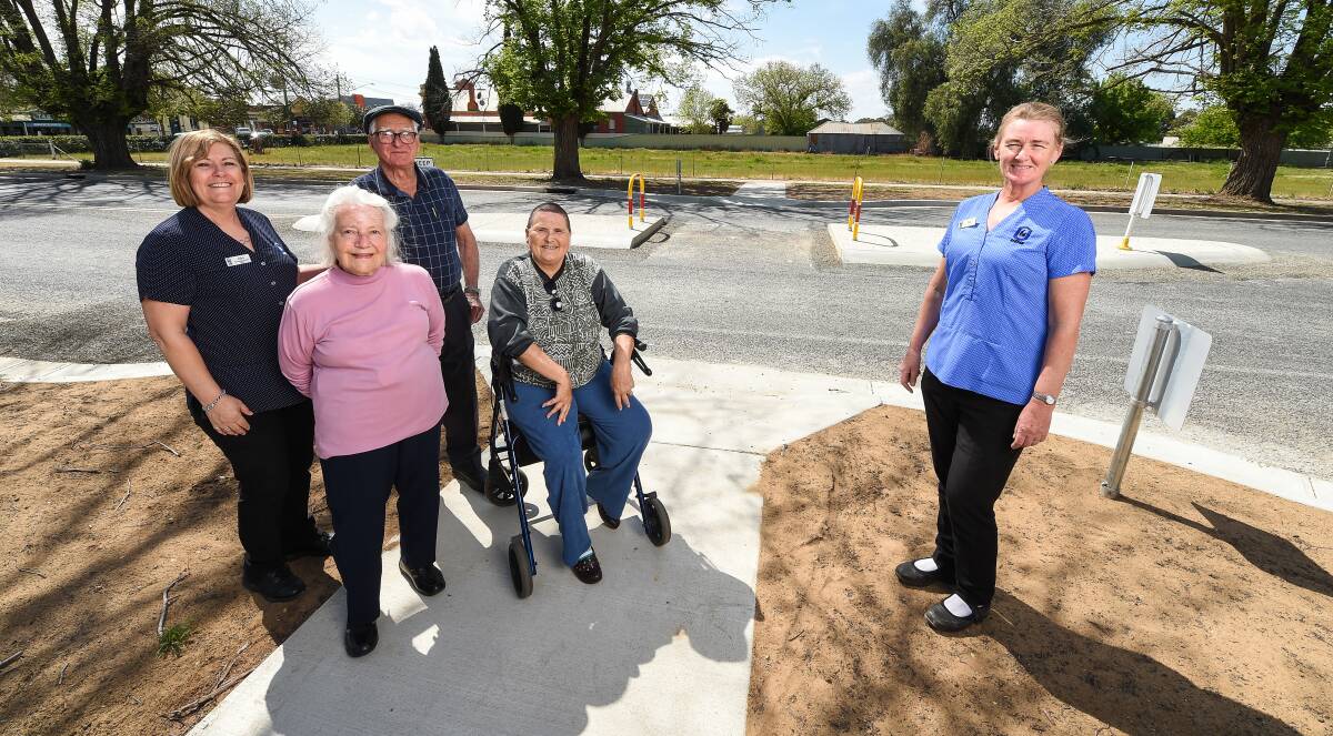 ACCESS IMPROVED: Oolong Hostel activities officer Jules Thompson, residents Dorothy Roman, Ken Harper and Gail Wenselowski and team leader Tina Anderson love the new crossing and its clear sight lines. Picture: MARK JESSER