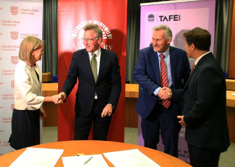 FORMAL PLAN: Charles Sturt University's Fiona Nash, Albury mayor Kevin Mack, Jonathon Davis, of TAFE NSW, and Member for Albury Justin Clancy at the signing.