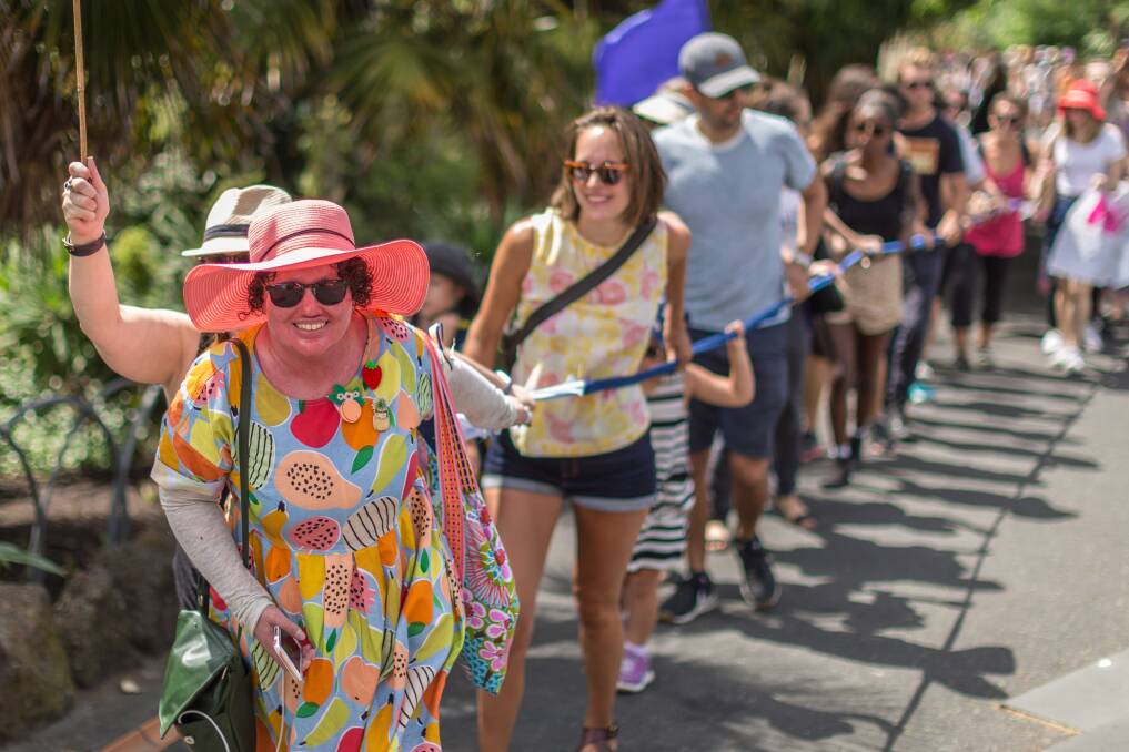 ACTIVIST: Carly Findlay leads the human chain across Princes Bridge as part of the Women's March in Melbourne last year. Picture: SCOTT MCNAUGHTON
