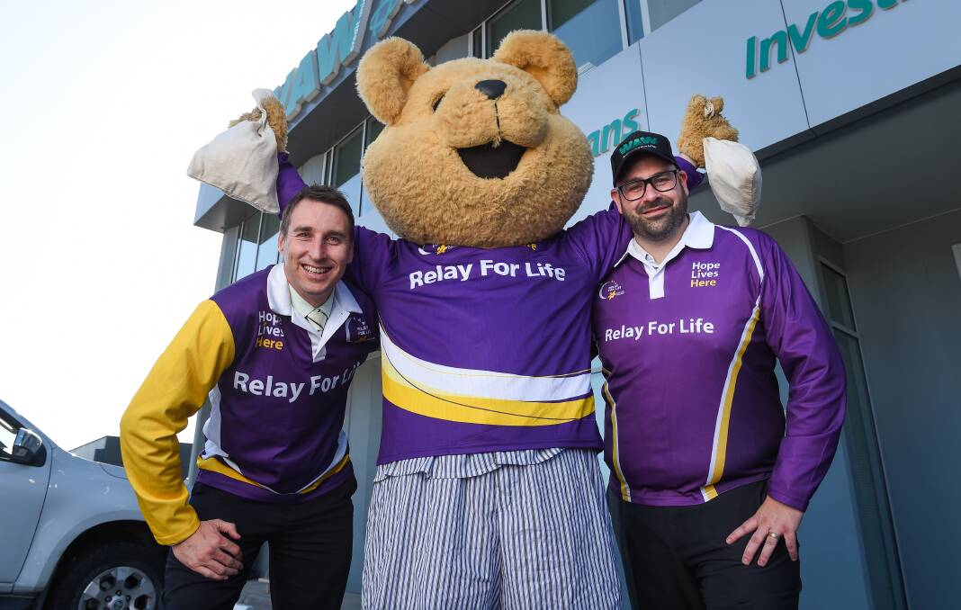 TEAMING UP: WAW Credit Union chief executive Michael Mack, Stan Vyce as the mascot and Paul Vaccaro are ready to relay. Picture: MARK JESSER