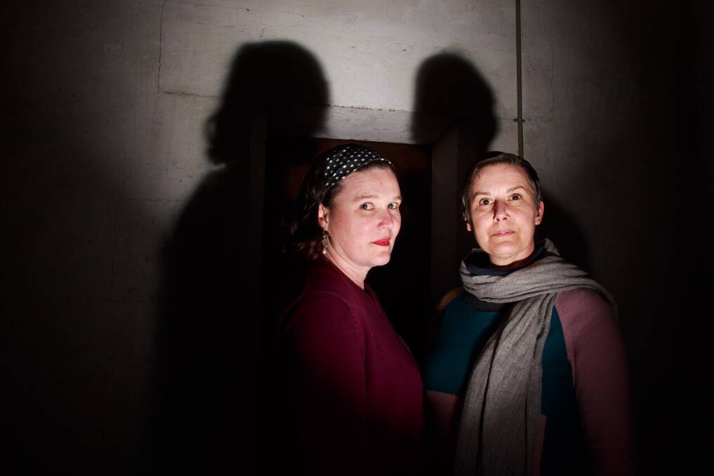 IN THE SHADOWS: Journalist Jackie Dent and artist Anna Tregloan explore the Albury venue for next month's installation The Ghost Project. Picture: SIMON BAYLISS