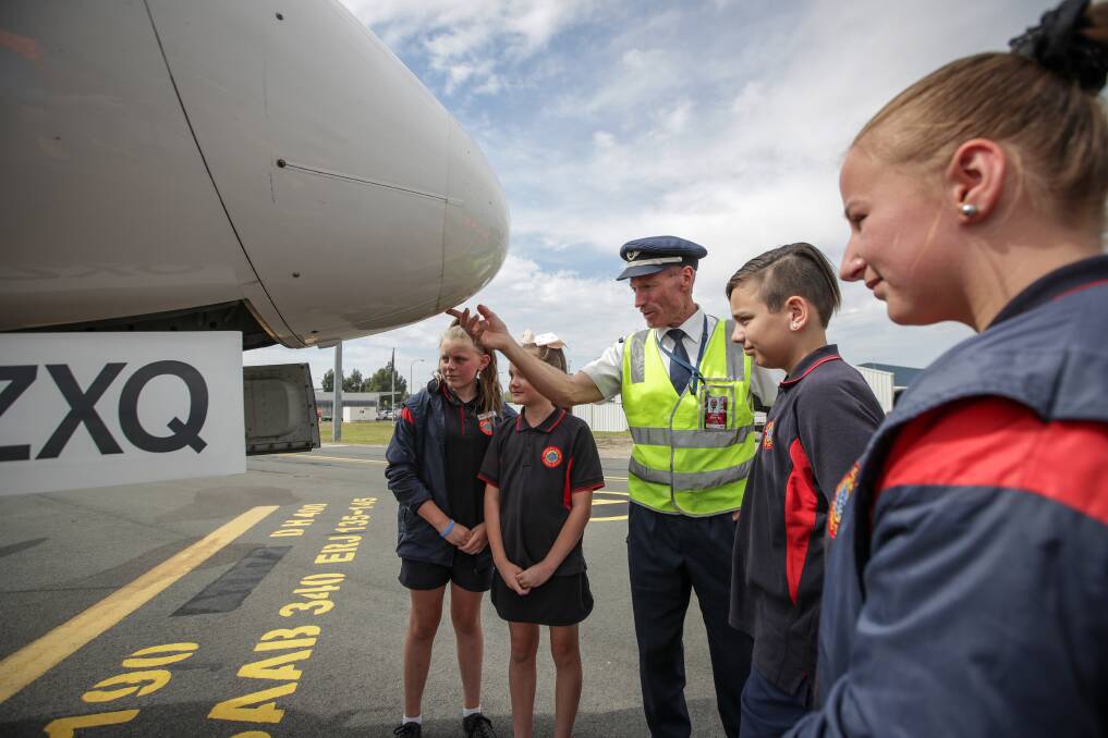 FLIGHT PREVIEW: Captain Ben Jones describes the aeroplane to the students. Picture: JAMES WILTSHIRE