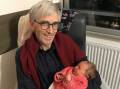 DOTING GRANDFATHER: Tim Landy and his granddaughter Céleste, one of his five grandchildren.