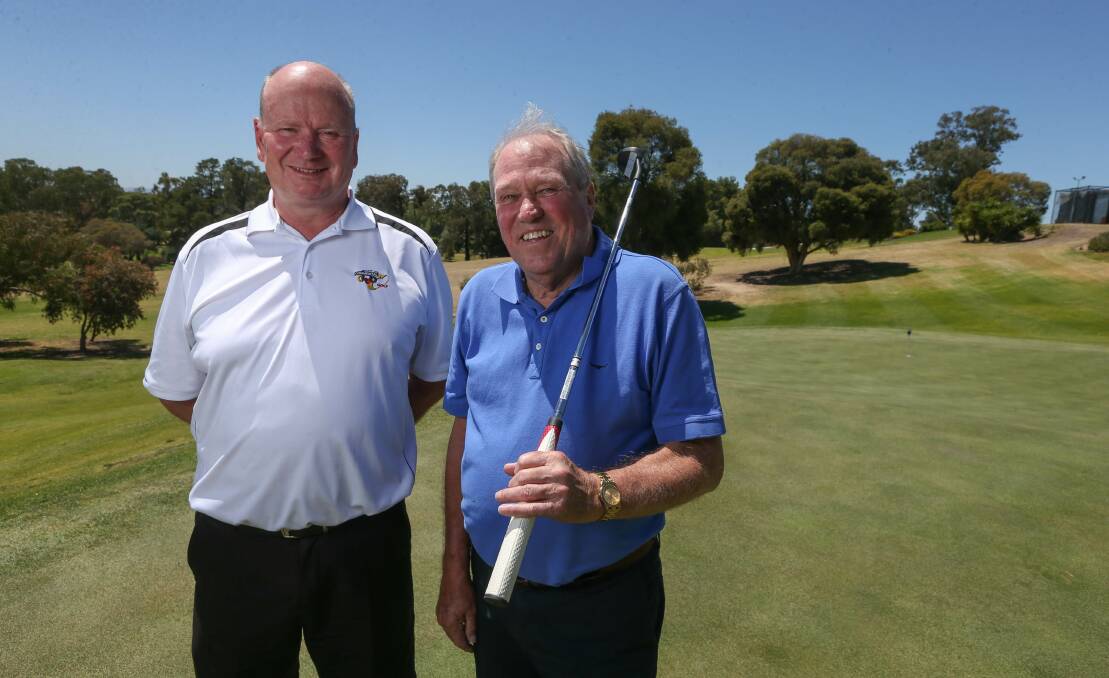 DAY ON THE GREEN: Commercial Golf Resort professional John van der Veen and Mayor's Charity Golf Day co-ordinator Terry Hudson prepare for Friday's event, which will raise money for Country Hope. Picture: TARA TREWHELLA