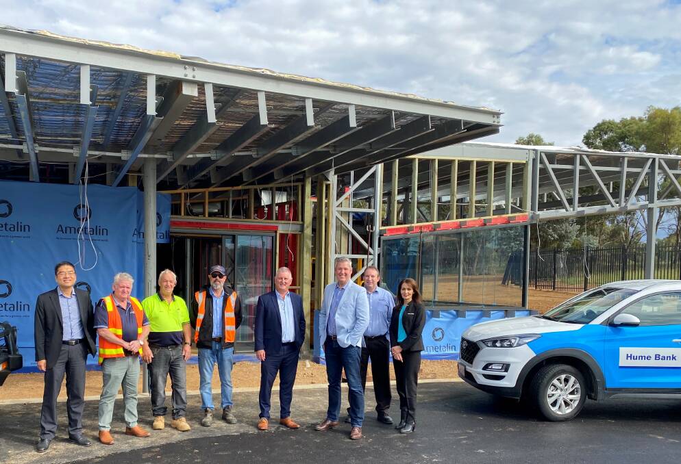 WORK IN PROGRESS: Representatives of Aspire Support Services and Hume
Bank visit the new day program facility being developed in Thurgoona. Picture: SUPPLIED