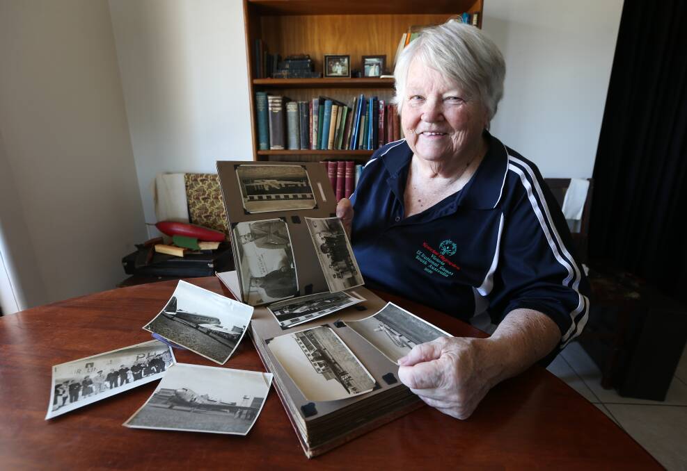 HISTORY PRESERVED: Wodonga's Joy Lawton looks through photos from Laverton airport, where the Uiver arrived after its unplanned visit to Albury. Picture: KYLIE ESLER