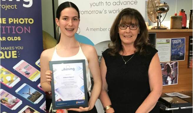 PRESENTATION: Indiana Haysom, 15, of Wodonga, receives her Shining A Light On Me prize from The Personnel Group chief executive Tracey Fraser. 