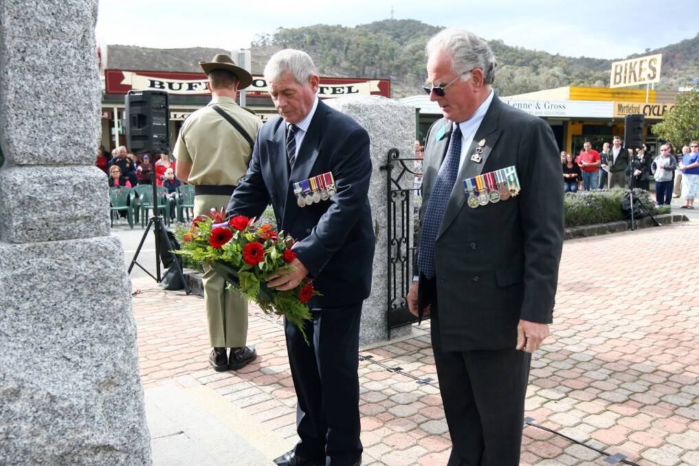 SERVICE BEFORE SELF: Kevin Pitts OAM, left, pictured on Anzac Day 2013, has a long history of helping out.