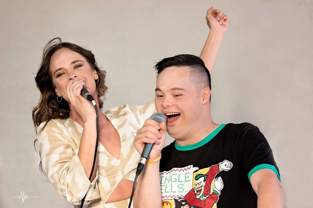 DYNAMIC DUO: Bonnie Anderson sings with Wahgunyah's Shane Kemp at Saturday's Christmas party. Picture: HICKLING PHOTOGRAPHY