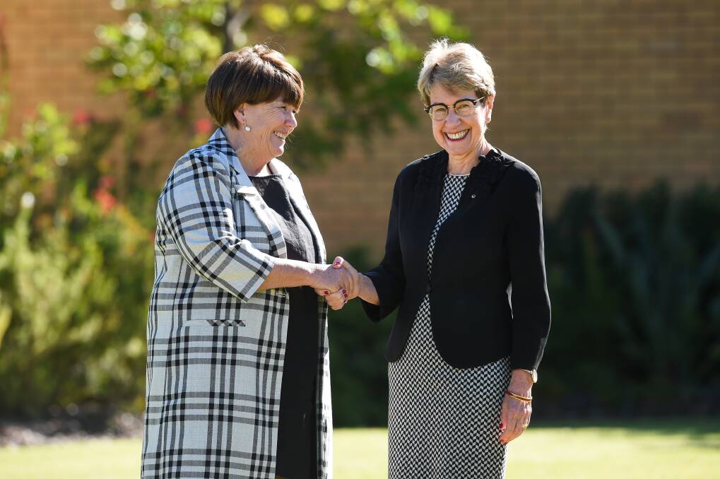 SESSIONS BEGIN: State president Annette Turner and NSW Governor Margaret Beazley shake hands after the official opening on Monday of the NSW Country Women's Association annual conference in Albury. Picture: MARK JESSER