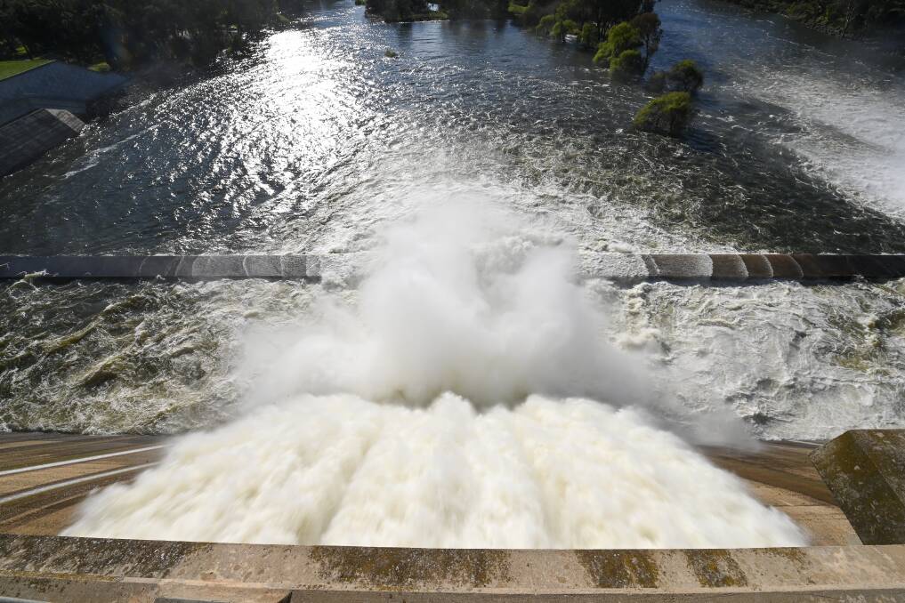 CAPACITY: Water spills from the Hume Dam, which has been close to full for some time. Picture: MARK JESSER