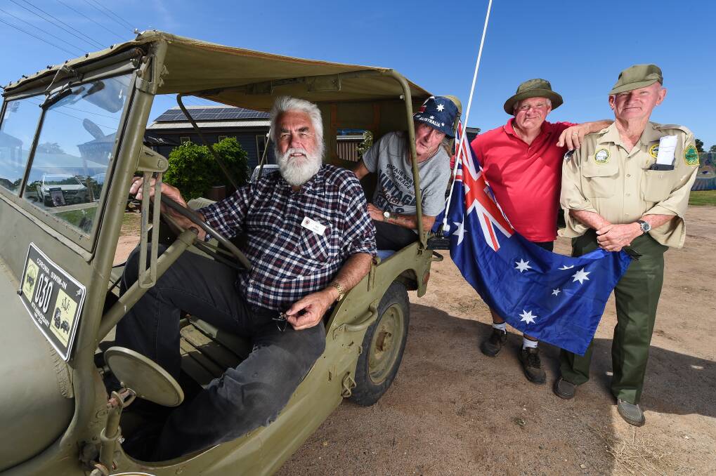 MATES GATHER: Friends Rod Roach, Gordon Fisher, Gus Shea and George Sellen show off a 1943 jeep. Picture: MARK JESSER