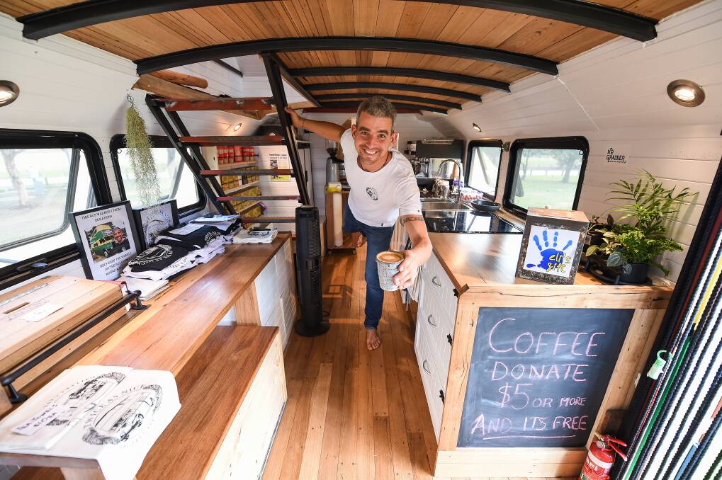 HELP ME HELP OTHERS: Lawrence Norton is travelling around Australia on his double decker bus, offering free coffee to people who donate $5 or more to Eli's Gift. Picture: MARK JESSER