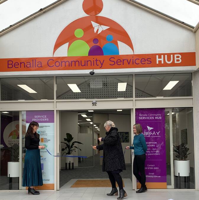 OPEN TO ASSIST: NESAY president Alison Maclean cuts the ribbon held by Centre Against Violence chief executive Jaime Chubb and VACCA acting director, eastern division Hannah Clancy at the official opening of Benalla Community Services Hub.