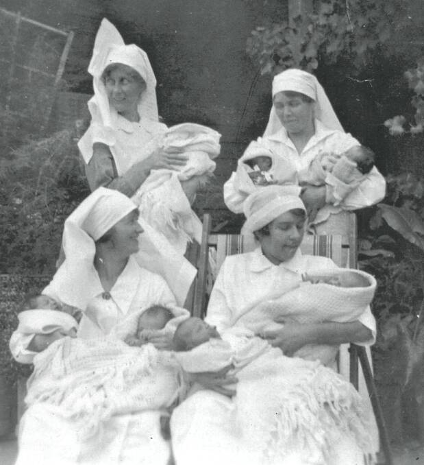 BABY BOOM: Emily Grace Chappell (back left) with other nurses and babies at Beechworth Hospital before she served in World War I.