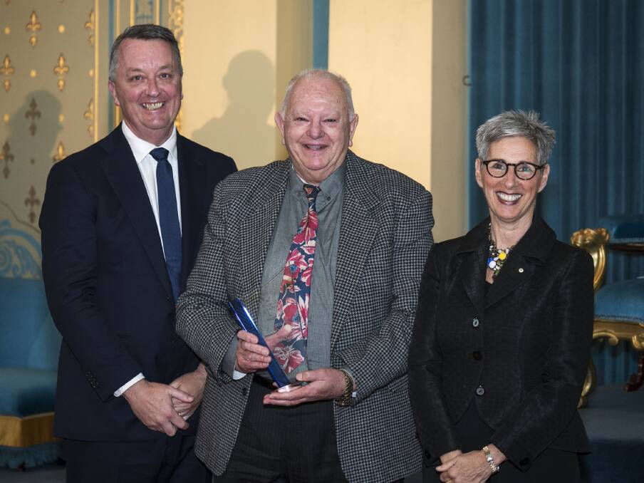 CONTRIBUTION HONOURED: The Victorian Senior of the Year Peter Hopper, of Bright, is congratulated by Minister for Ageing Martin Foley and Victorian Governor Linda Dessau after the 2015 award presentation ceremony in Melbourne.