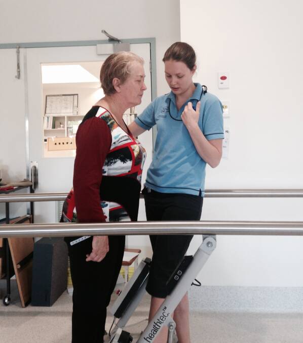 STEADY PROGRESS: Libby Mourik works through some rehabilitation exercises at Wodonga hospital on October 20, 2015, assisted by physiotherapist Abby Heafield. 