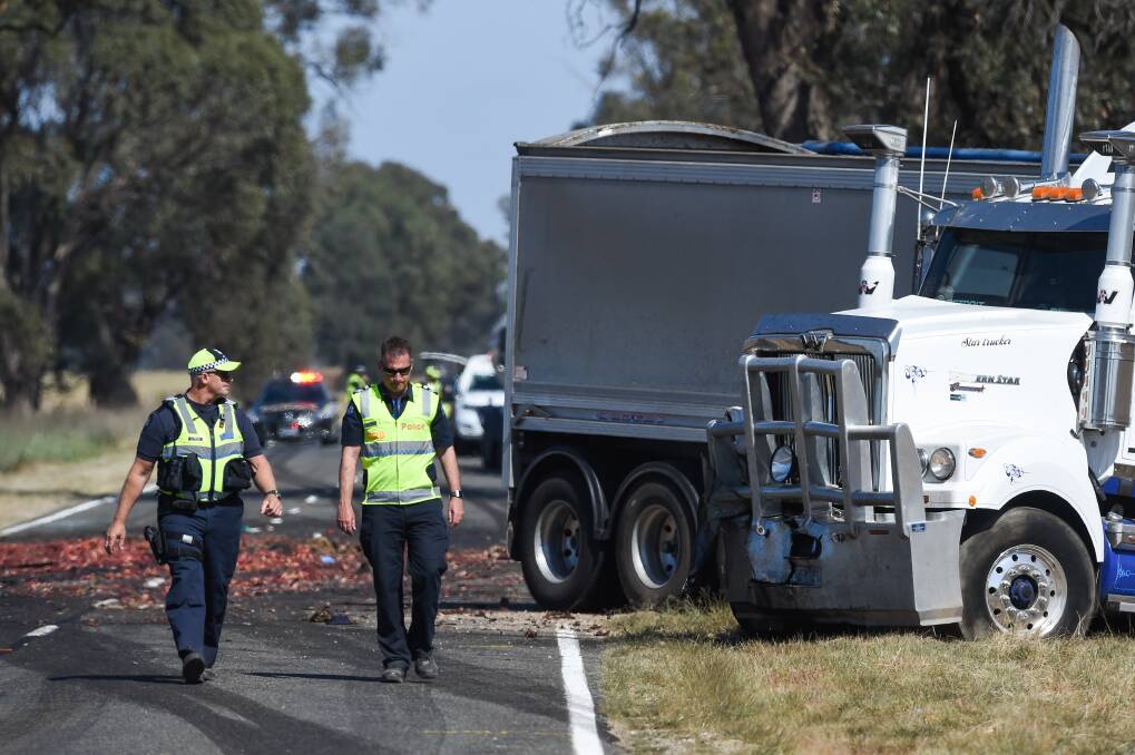 SHOCKING SCENE: Emergency personnel on the Murray Valley Highway at Brimin, the day after the crash. Picture: MARK JESSER