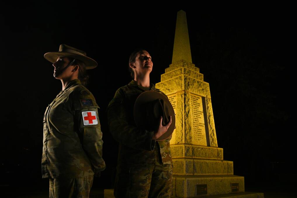 ONGOING SUPPORT: Army personnel Sergeant Nicola Emsley and Captain Jess Limmer who worked on Operation COVID-19 Assist this past year pictured at the Wodonga cenotaph ahead of Anzac Day. Picture: MARK JESSER