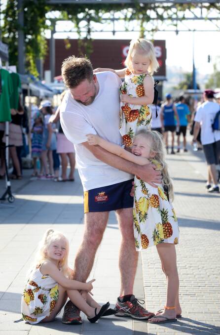 HAPPY CREW: James Harris and his daughters Belle, 3, Evie, 5, and Peggy, 22 months, at the finish line of Sunday's City2City. Picture: KYLIE ESLER