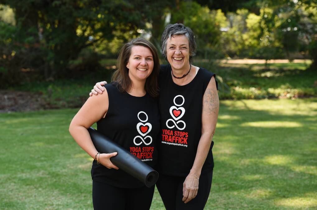 RIPPLE EFFECT: Karla Horn and Gaelle Pettifer say people can just turn up to their Yoga Stops Traffick session on Sunday morning and encourage families to attend. Picture: MARK JESSER