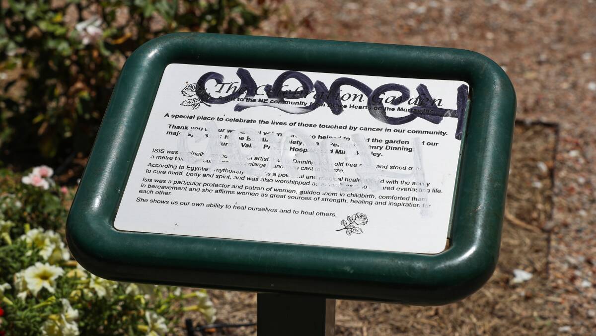 Vandals also defaced the plaque that explains the purpose of the garden. Picture: MARK JESSER