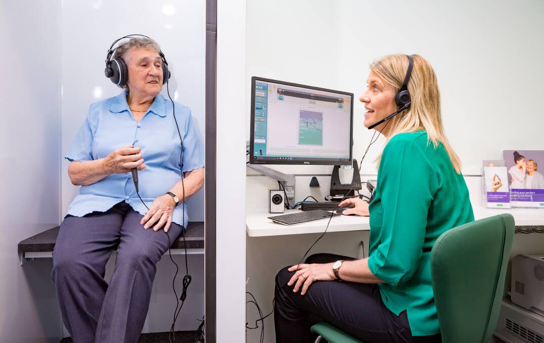 REGULAR CHECKS: Specsavers audiologist Kathy Currie tests the hearing of Albury's Margaret Livingstone at Wodonga Plaza last year.