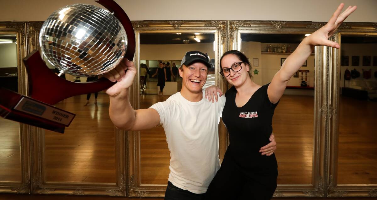LEARNING LATIN: Television journalist Mark Blackman and his teacher Megan Reid Tonkin get into a dancing mood. Picture: JAMES WILTSHIRE