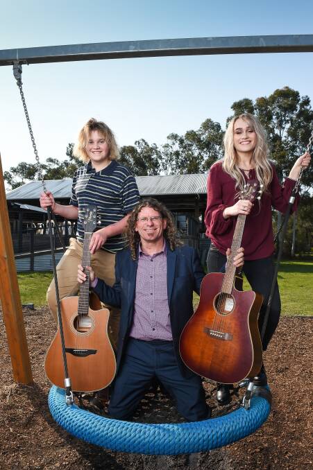 SUNSHINE WEEK: Zac Spalding, 13 and his sister Eliza, 16, hang out with Border entertainer Steve Bowen ahead of Sunday's cancer centre fundraiser. Picture: MARK JESSER