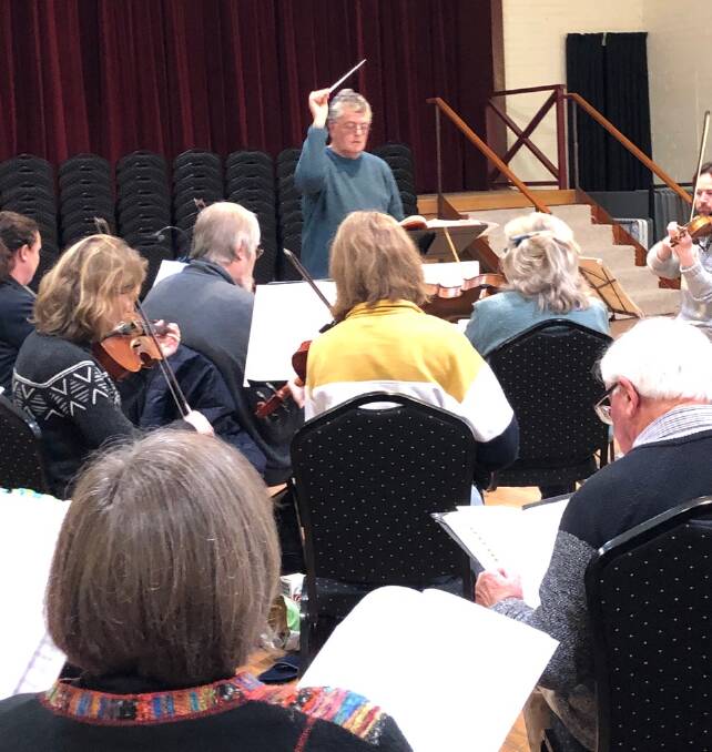COMBINED RESOURCES: Paul Tasker conducts the singers and musicians during Messiah rehearsals in Beechworth ahead of the Three Choirs Festival 2019.