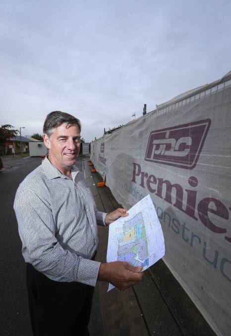 PLANS TAKE SHAPE: UPA Murray River regional director Tony Dunn looks over plans for the construction project in Wagga Road, Lavington. Picture: JAMES WILTSHIRE
